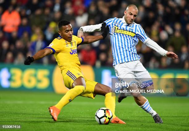 Juventus' Brazilian defender Alex Sandro vies with Spal's Italian defender Filippo Costa during the Italian Serie A football match Spal vs Juventus...