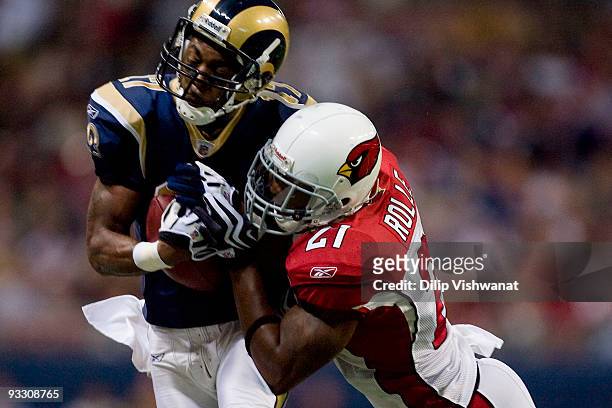 Antrel Rolle of the Arizona Cardinals tackles Donnie Avery of the St. Louis Rams at the Edward Jones Dome on November 22, 2009 in St. Louis,...