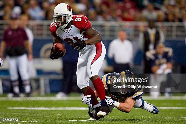 Anquan Boldin of the Arizona Cardinals is tackled by James Laurinaitis of the St. Louis Rams at the Edward Jones Dome on November 22, 2009 in St....