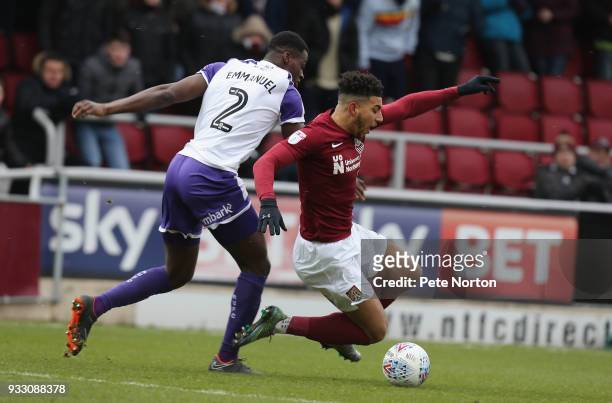Daniel Powell of Northampton Town goes to ground under the challenge of Josh Emmanuel of Rotherham United during the Sky Bet League One match between...
