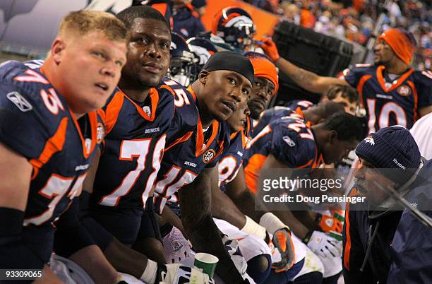 Chris Kuper, Ryan Clady, Brandon Marshall, David Graham, Knowshon Moreno, Jabar Gaffney and the Denver Broncos offense look on from the bench as they...