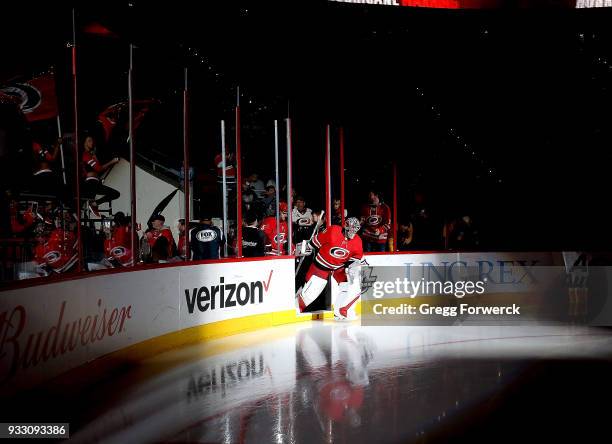 Cam Ward of the Carolina Hurricanes enters the ice prior to an NHL game against the Boston Bruins on March 13, 2018 at PNC Arena in Raleigh, North...