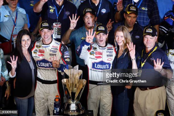 Crew chief Chad Knaus, girlfriend Lisa Rockelmann, Jimmie Johnson , driver of the Lowe's Chevrolet, poses with his wife Chandra after winning the...