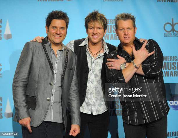Musicians Jay DeMarcus, JoeDon Rooney and Gary LeVox of Rascal Flatts, winners of Country Favorite Band, Duo Or Group pose in the press room at the...