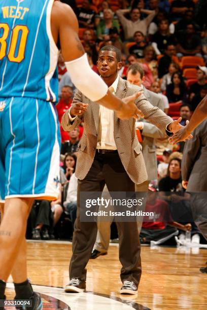 Chris Paul of the New Orleans Hornets leads David West of the New Orleans Hornets against the Miami Heat on November 22, 2009 at American Airlines...