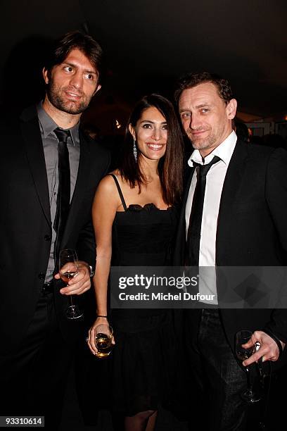 Caterina Murino, guest and Jean Paul Rouve attend the OTM Association dinner hosted by Babeth Djian and Pierre Pelegry, to raise funds for the...