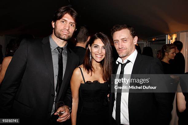 Caterina Murino, guest and Jean Paul Rouve attend the OTM Association dinner hosted by Babeth Djian and Pierre Pelegry, to raise funds for the...