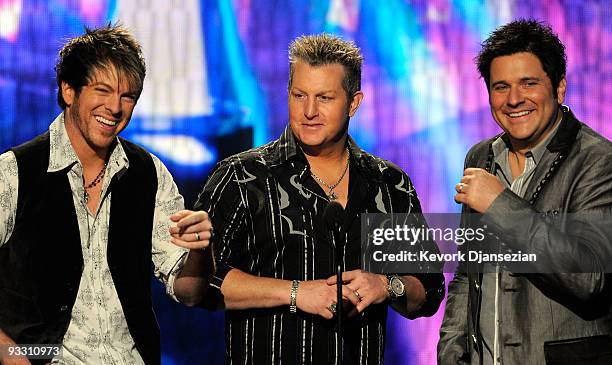 Musicians Joe Don Rooney , Gary LeVox and Jay DeMarcus of Rascal Flatts accept Winner of Country - Favorite Band, Duo or Group Award onstage at the...