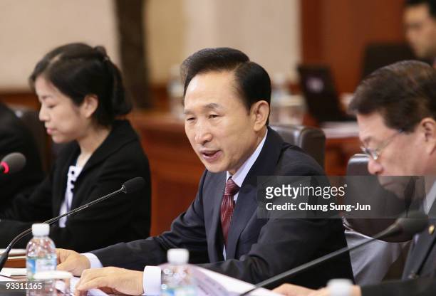 South Korean President Lee Myung-Bak attends a meeting with Senegal President Abdoulaye Wade at the Presidential House on November 23, 2009 in Seoul,...