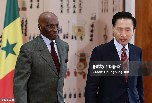 Senegal President Abdoulaye Wade and South Korean President Lee Myung-Bak walk before their meeting at the presidential blue house on November 23,...