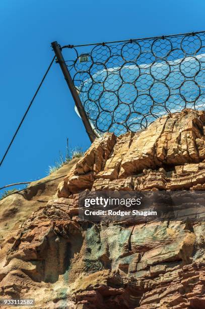 protective catch fences on chapmans peak drive. cape town, south africa. - chapmans peak stock pictures, royalty-free photos & images