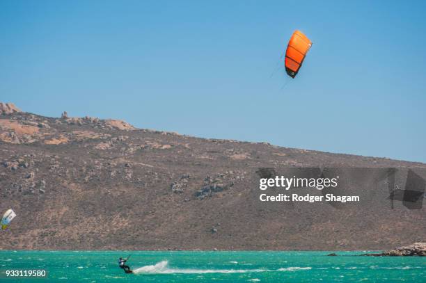 kite surfing. langebaan lagoon, western cape province, south africa. - kite lagoon stock-fotos und bilder