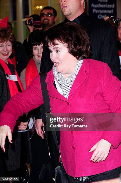 Singer Susan Boyle greets fans at the John F. Kennedy International Airport on November 22, 2009 in New York City.
