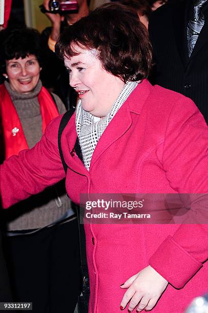 Singer Susan Boyle greets fans at the John F. Kennedy International Airport on November 22, 2009 in New York City.