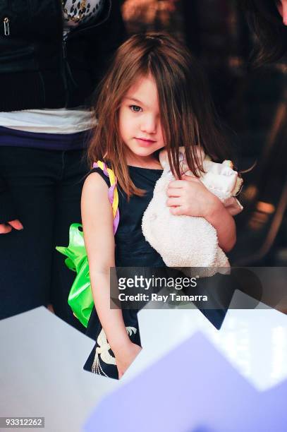 Suri Cruise shops in Topshop on November 22, 2009 in New York City.