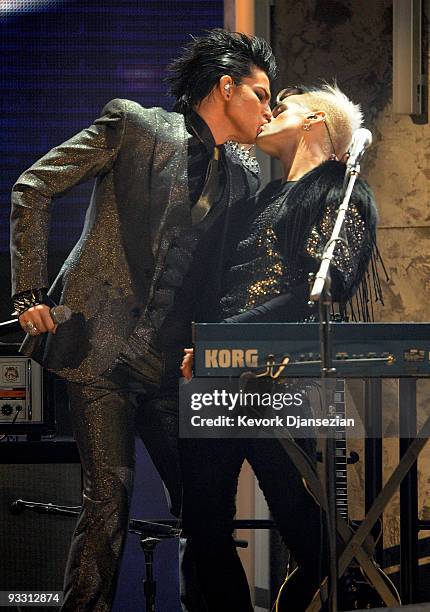 Singer Adam Lambert and a musician kiss onstage at the 2009 American Music Awards at Nokia Theatre L.A. Live on November 22, 2009 in Los Angeles,...