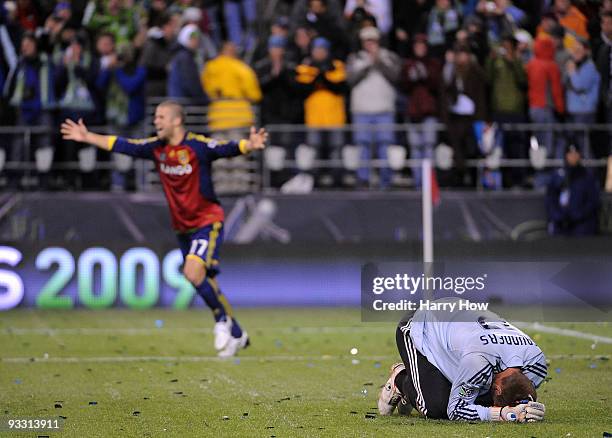 Josh Saunders of the Los Angeles Galaxy reacts after allowing the game winning goal as Chris Wingert of Real Salt Lake celebrates during the MLS Cup...