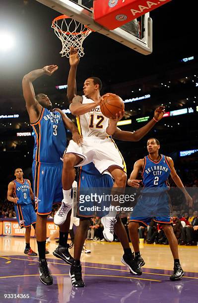 Shannon Brown of the Los Angeles Lakers drives to the basket while being defended by D.J. White of the Oklahoma City Thunder in the second half at...