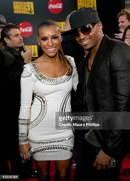 Singer Melody Thornton and Rob Lewis arrive at Coca Cola on the 2009 American Music Awards Red Carpet at the Nokia Theatre L.A. Live on November 22,...