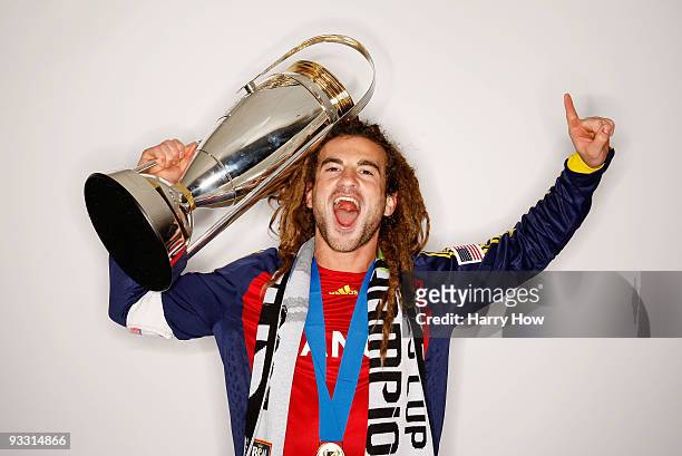 Kyle Beckerman of Real Salt Lake poses with the Philip F. Anschutz MLS Cup trophy following their win in the MLS Cup final at Qwest Field on November...