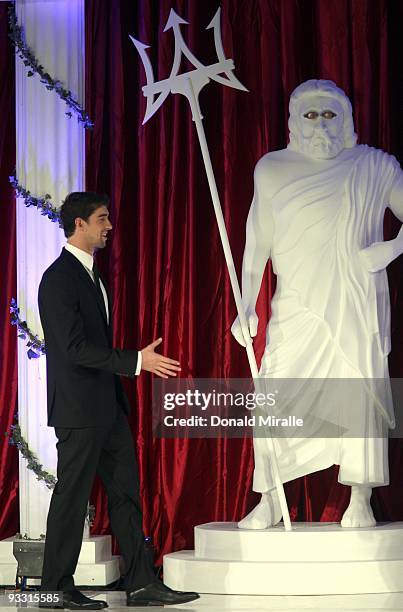 Swimmer Michael Phelps on stage next to the statue of Posideon during the 2009 USA Swimming Foundation Golden Goggles Awards on November 22, 2009 at...