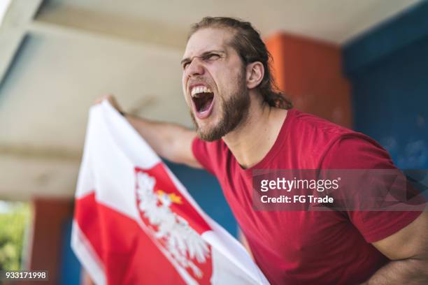 polish fan watching a soccer game - poland soccer fans stock pictures, royalty-free photos & images