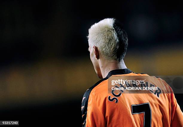 Wigan Athletic's Austrian player Paul Scharner sporting a black and white hairstyle walks during play against Tottenham Hotspurs during the...