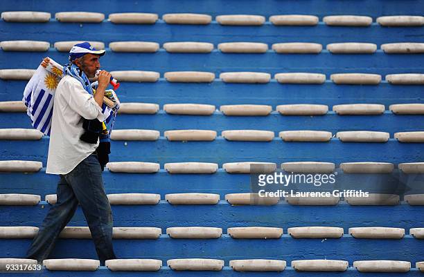 Uruguayan flag seller in the stands duing the 2010 FIFA World Cup Play Off Second Leg Match between Uruguay and Costa Rica at The Estadio Centenario...