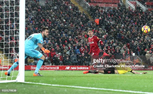 The header of Robert Firmino of Liverpool goes wide during the Premier League match between Liverpool and Watford at Anfield on March 17, 2018 in...