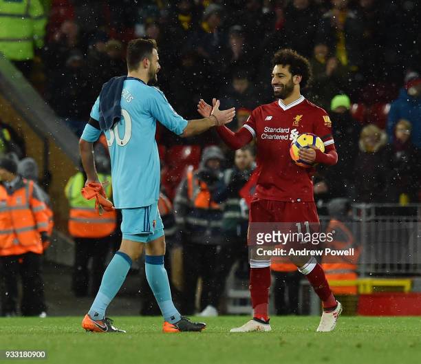 Mohamed Salah of Liverpool with his match ball after scoring four goals with Orestis Karnezis of Watford at the end of the Premier League match...