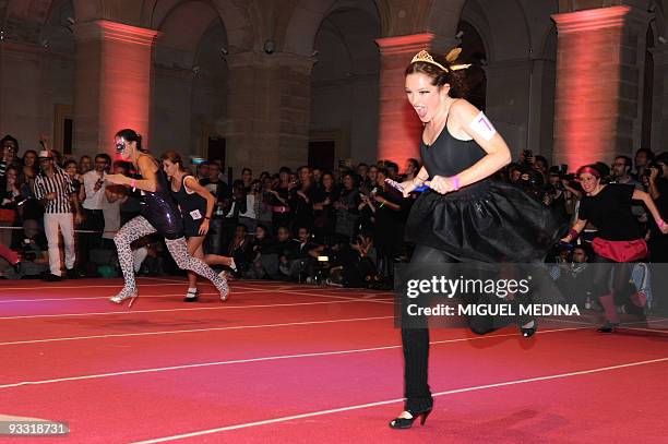 Women compete for the "Race on Heels" on November 20, 2009 in Paris.A total 96 shoe addicts, a common condition with fashionistas, have signed up for...