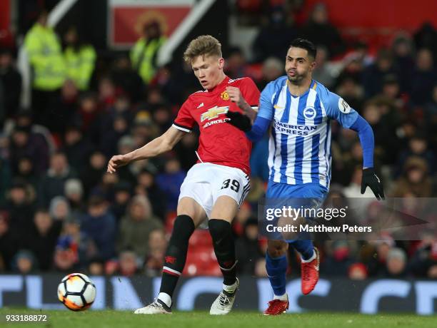 Scott McTominay of Manchester United in action with Beram Kayal of Brighton & Hove Albion during the Emirates FA Cup Quarter Final match between...