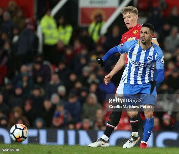 Scott McTominay of Manchester United in action with Beram Kayal of Brighton & Hove Albion during the Emirates FA Cup Quarter Final match between...