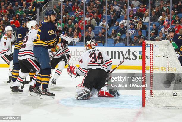 Justin Bailey of the Buffalo Sabres watches a goal by Nicholas Baptiste against J-F Berube of the Chicago Blackhawks during an NHL game on March 17,...