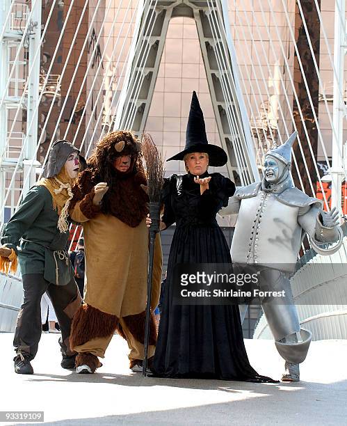 Lorna Luft in character as the Wicked Witch poses in costume with Scarecrow Ian Casey, Lion Jamie Greer and Tin Man Joe Standerline during a...