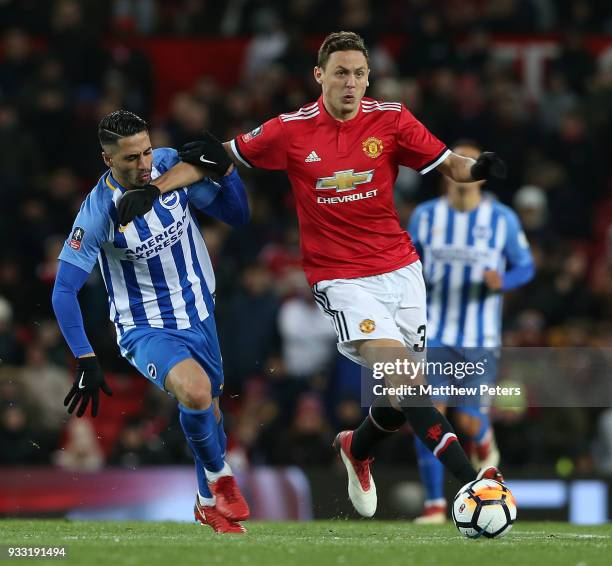 Nemanja Matic of Manchester United in action with Beram Kayal of Brighton & Hove Albion during the Emirates FA Cup Quarter Final match between...