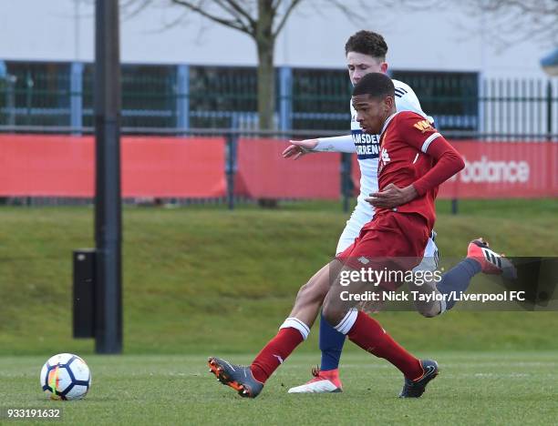 Elijah Dixon-Bonner of Liverpool and Cain Sykes of Middlesbrough in action during the Liverpool v Middlesbrough U18 Premier League game at The Kirkby...