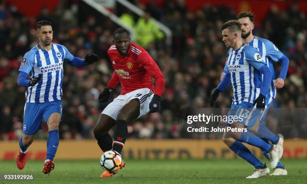 Romelu Lukaku of Manchester United in action with Beram Kayal and Pascal Gross of Brighton & Hove Albion during the Emirates FA Cup Quarter Final...