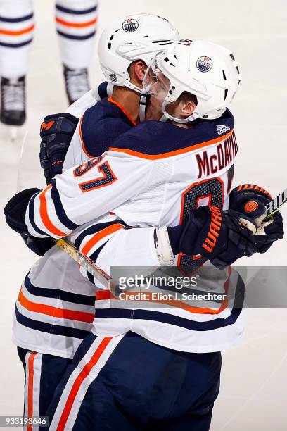 Connor McDavid of the Edmonton Oilers celebrates his goal with teammate Darnell Nurse against the Florida Panthers at the BB&T Center on March 17,...