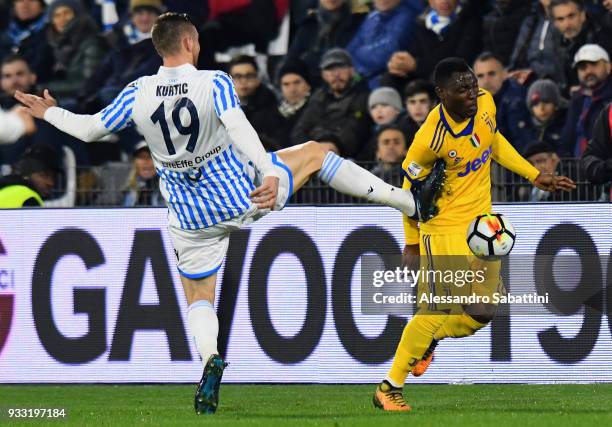 Jasmin Kurtic of Spal competes for the ball whit Kwadwo Asamoah of Juventus during the serie A match between Spal and Juventus at Stadio Paolo Mazza...