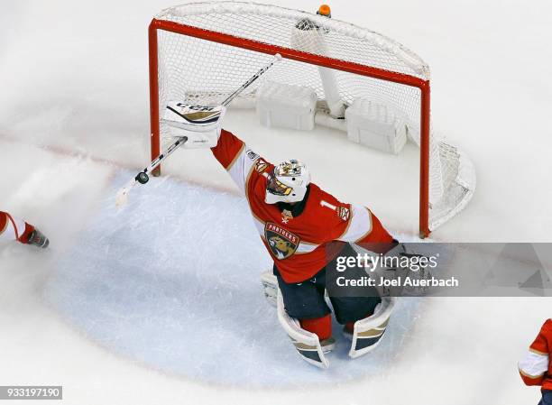 Goaltender Roberto Luongo of the Florida Panthers makes a stick save on a hot by the Edmonton Oilers during third period action at the BB&T Center on...