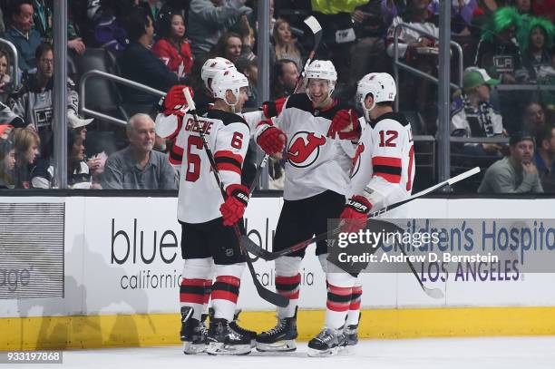 Ben Lovejoy, Travis Zajac, Michael Grabner, and Andy Greene of the New Jersey Devils celebrate after scoring a goal against the Los Angeles Kings at...