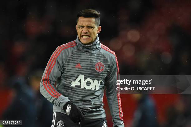 Manchester United's Chilean striker Alexis Sanchez warms up before the English FA Cup quarter-final football match between Manchester United and...