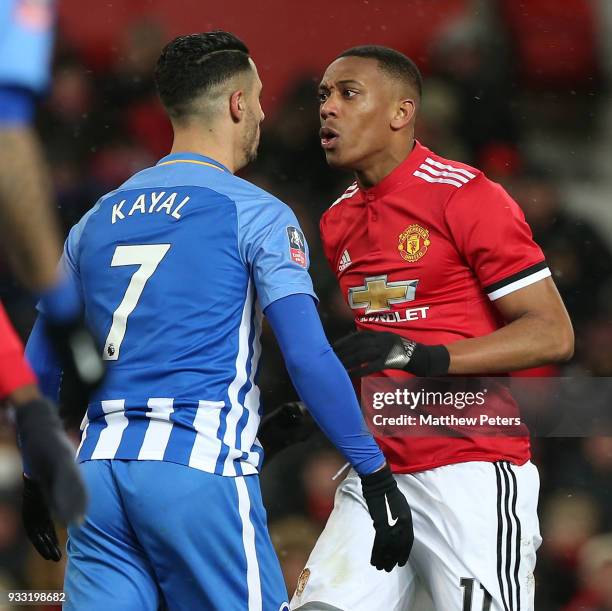 Anthony Martial of Manchester United clashes with Beram Kayal of Brighton & Hove Albion during the Emirates FA Cup Quarter Final match between...