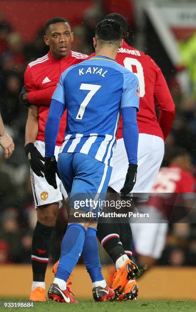 Anthony Martial of Manchester United clashes with Beram Kayal of Brighton & Hove Albion during the Emirates FA Cup Quarter Final match between...