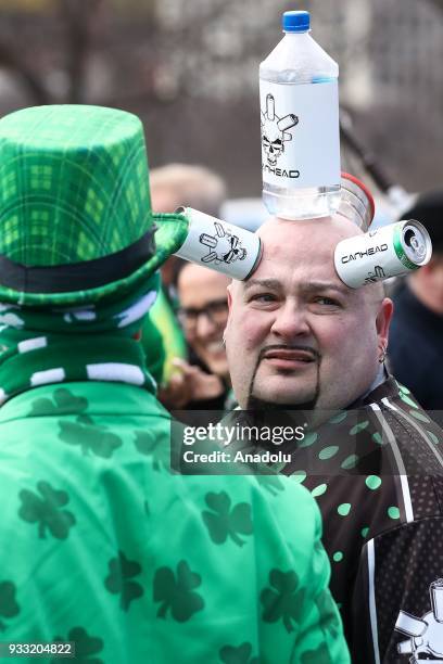 Man with accessories participates in the annual St. Patrick's Day celebrations on March 17, 2018 in Chicago, United States.