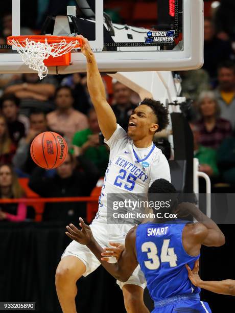 Washington of the Kentucky Wildcats dunks the ball during the first half against Ikenna Smart of the Buffalo Bulls in the second round of the 2018...