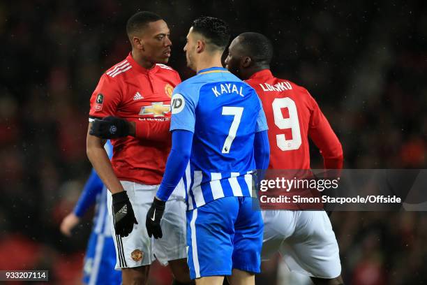 Anthony Martial of Man Utd squares up to Beram Kayal of Brighton as Romelu Lukaku of Man Utd intervenes during The Emirates FA Cup Quarter Final...