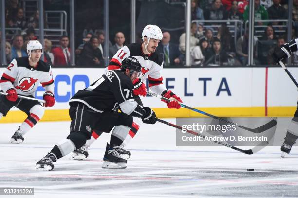 Torrey Mitchell of the Los Angeles Kings battles for the puck against Brian Boyle of the New Jersey Devils at STAPLES Center on March 17, 2018 in Los...