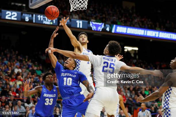 Wes Clark of the Buffalo Bulls shoots the ball against Sacha Killeya-Jones and PJ Washington of the Kentucky Wildcats during the first half in the...